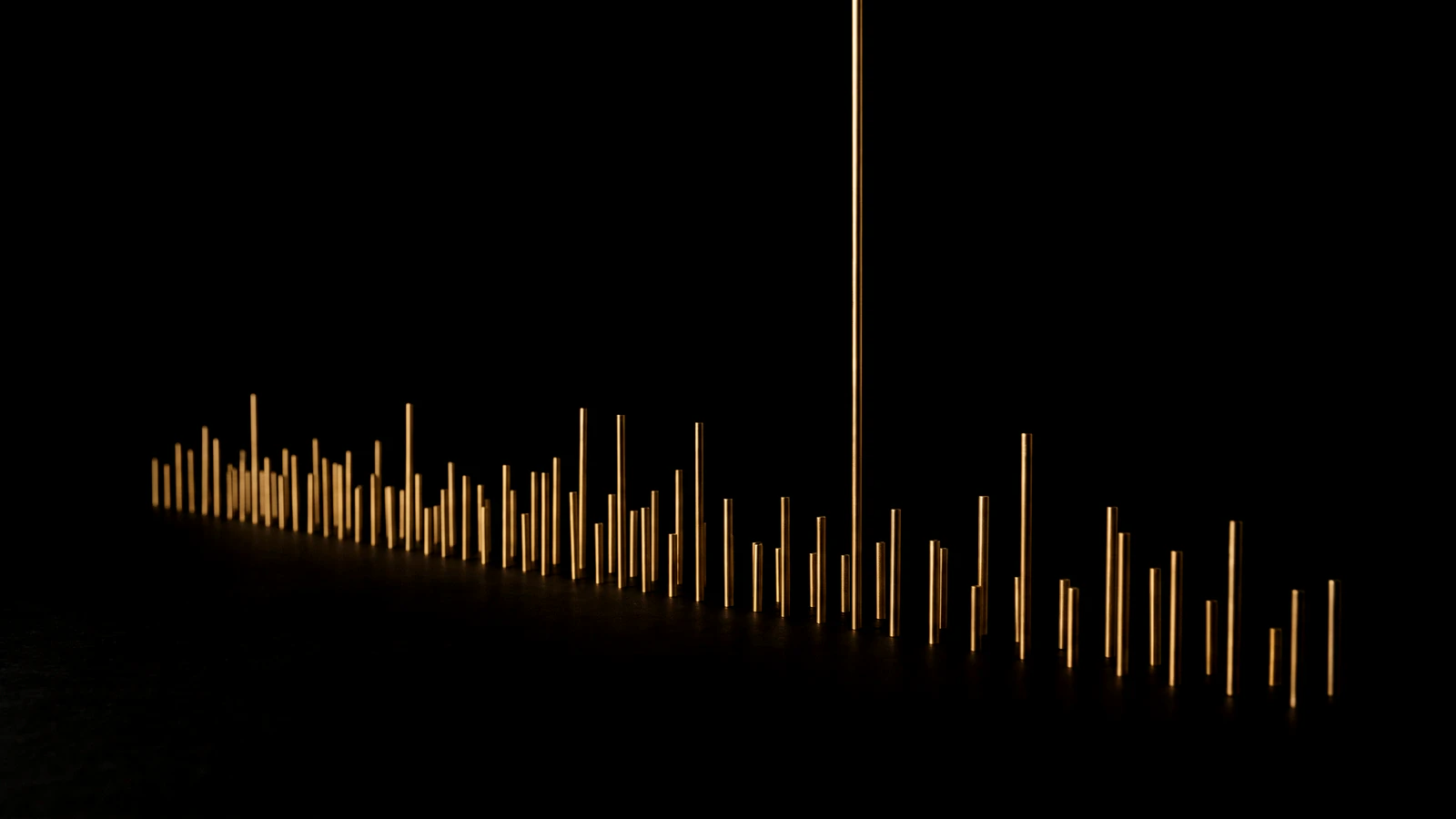 A long row of brass rods on black, all at unequal heights, one standing far above the rest.